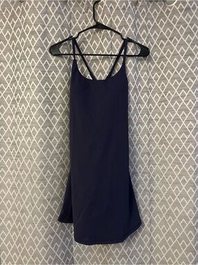 Halara Navy Strappy Slip Dress with shorts underneath.